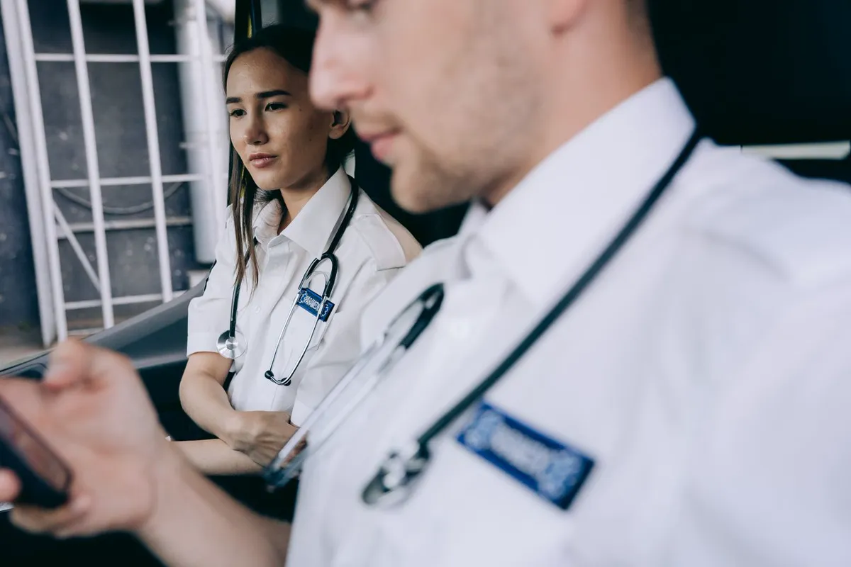 Allied health professionals reviewing patient information on a tablet