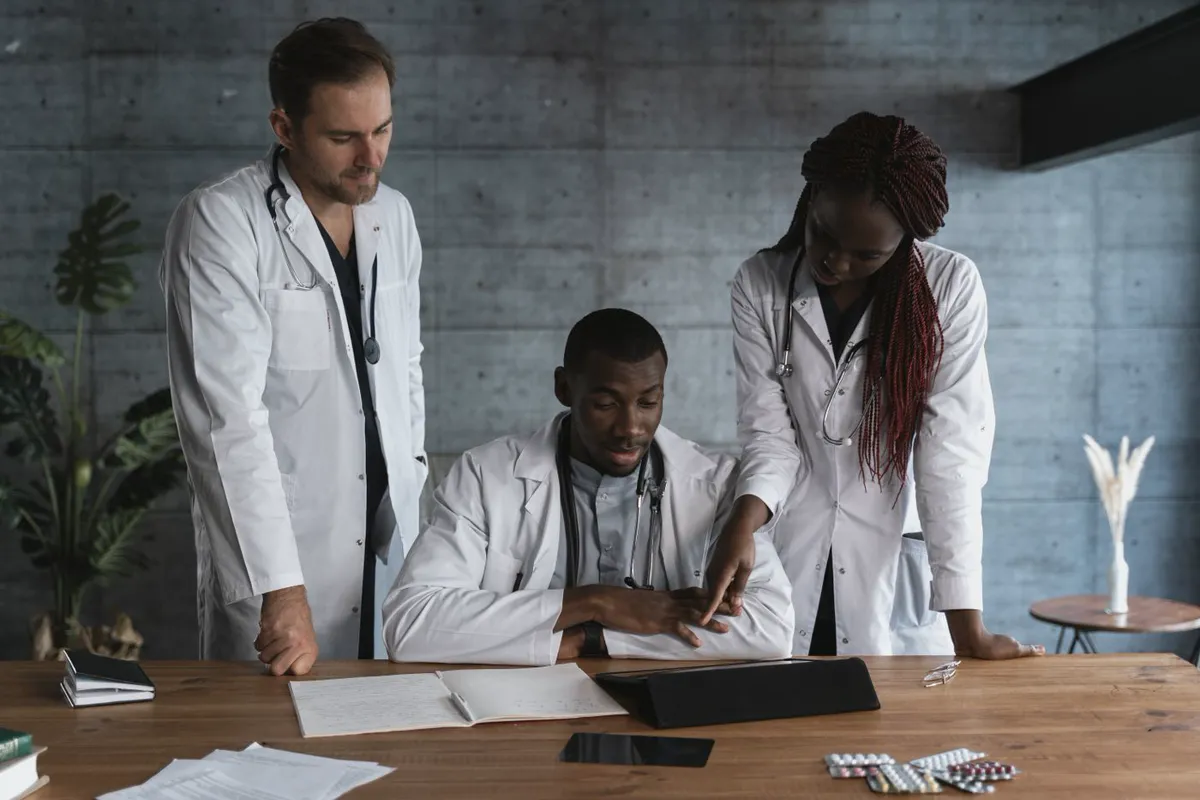 Clinicians reviewing paperwork together at a healthcare facility